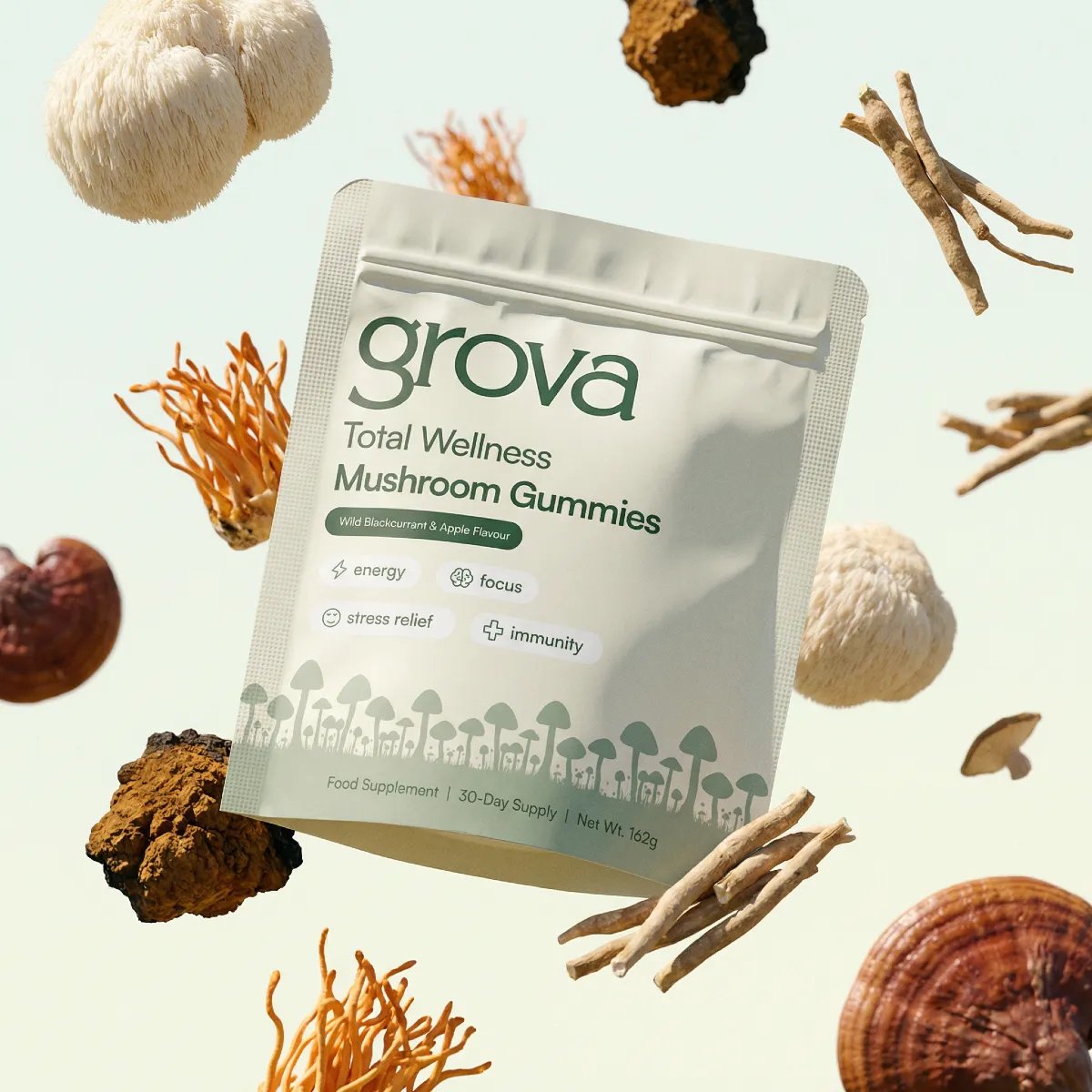 Total Wellness Mushroom Gummies surrounded by functional mushrooms and adaptogens